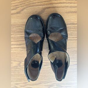 Black Leather Cross-Strap Shoes by Fly London